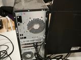 a computer sitting on top of a table next to a laptop computer