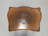 an old wooden chair with a wooden seat and back rest