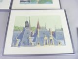 three framed pictures of a castle with a clock tower on top of it