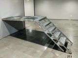a picture of a stainless steel ramp in a building