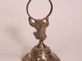 an image of a silver plate with a ring on top of it
