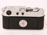 a black and white photo of a camera on a white background