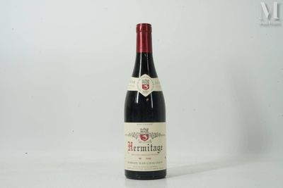 a bottle of wine that is sitting on a table