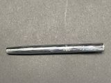 a pen that is laying on a table