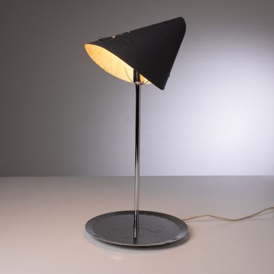 a close up of a lamp on a table with a white background