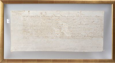a close up of a piece of paper in a frame on a wall