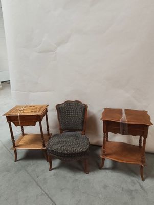 three chairs and a table in the corner of a room