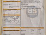 une photo d'un ticket de caisse sur laquelle figure la photo d'une voiture