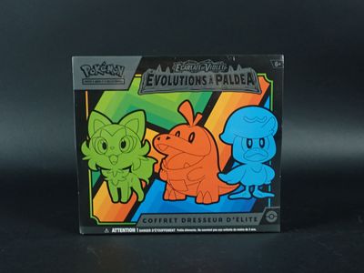 une boîte de jouets Pokémon posée sur une surface noire