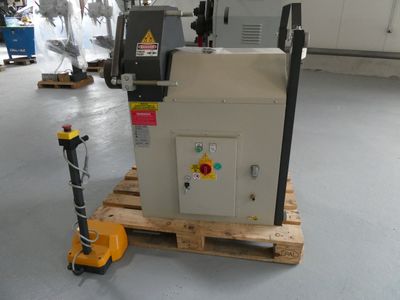 a machine that is sitting on a pallet in a warehouse