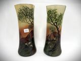 pair of hand painted vases with trees and animals on them