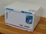 a white microwave sitting on top of a wooden table
