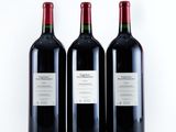 three bottles of wine sitting next to each other on a table
