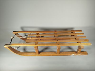 an image of a wooden sled sitting on top of a table