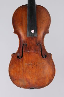 an old violin with a black bow on a white background