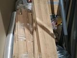a pile of wood sitting on the floor in a room