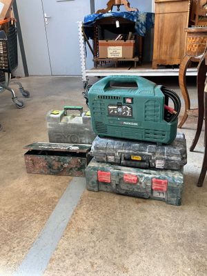 a green generator sitting on top of a stack of boxes