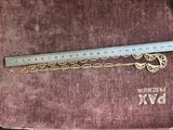 a book with a bookmark and a ruler on it