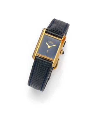 an image of a gold plated wrist watch on a black leather strap