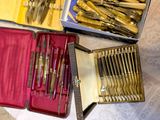 many different types of knives in a case on the table