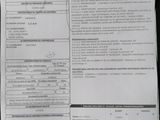 a picture of a car ' s driver ' s license and information sheet