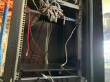a rack with wires and wires in it in a room