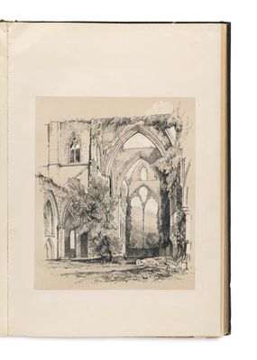 un livre ouvert dans lequel figure le dessin d'un bâtiment