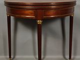 an image of a small table with a curved top