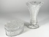 pair of cut glass vases and a box on a white surface