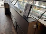 a glass display case in the middle of a room