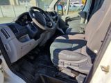 a white van with a steering wheel and a dashboard