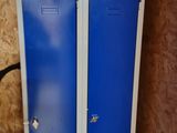 two blue lockers next to each other in a room
