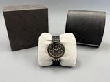 an image of a watch sitting in a box with a bow tie