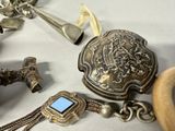 a lot of silver items that are on a table