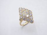 a close up of a gold ring with diamonds on a white background