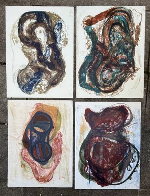 four paintings of different shapes and sizes on paper on a sidewalk