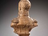 marble bust of a man with a lion ' s head on a pedestal