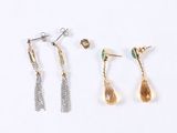 three pairs of earrings and a pair of earrings on a white background