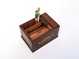 a small wooden box with a toy figure inside of it