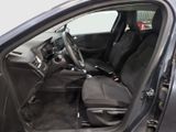 the interior of a car with the door open and the driver ' s seat down