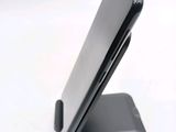 a close up of a cell phone on a stand