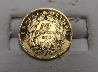 an image of a gold coin on a white surface