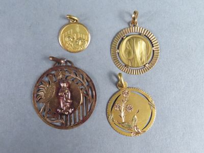 three gold and silver pendants with a picture of a woman and a bird