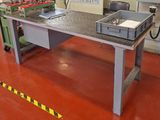 an image of a workbench in a factory with a lot of tools