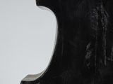 an image of a black sculpture on a white surface