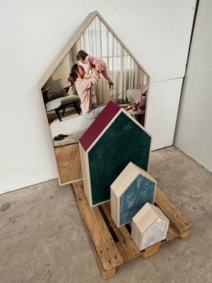 a picture of a house made out of wood and a mirror