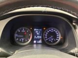 a close up of a car dashboard with various gauges