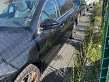 a black car parked in front of a building
