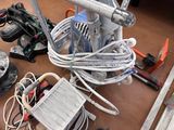 a lot of wires and tools on the floor