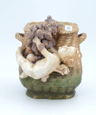 a ceramic vase with a dog and a basket full of animals